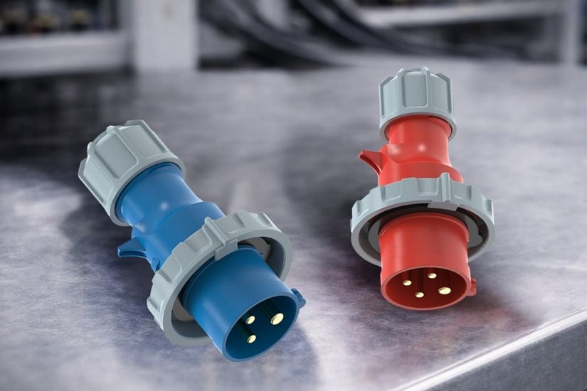 Blue 230V and Red 400V Plugs A close-up shot of a standard blue 230V plug and a red 400V plug side-by-side for comparison.