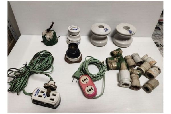 Early Plug and Socket Standards An old black and white photo of different incompatible plugs from the early 20th century.