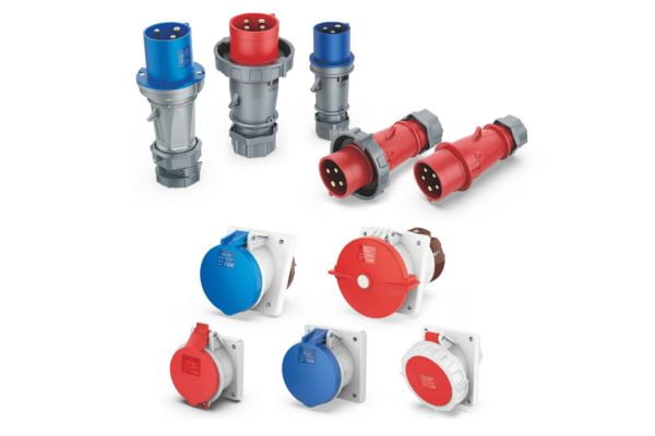 An assortment of blue and red industrial plugs and sockets.