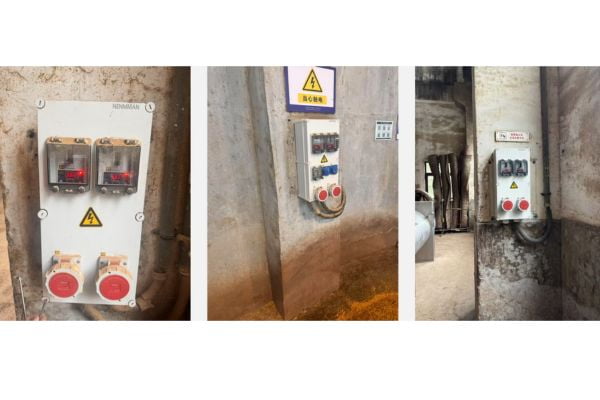 A wall-mounted mechanical interlock socket with a large red switch.